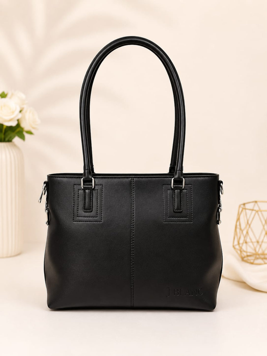 Black structured tote bag – top view showing interior zip compartment